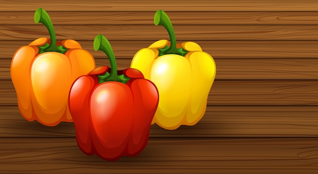 Vector three different bell pepper on wooden background