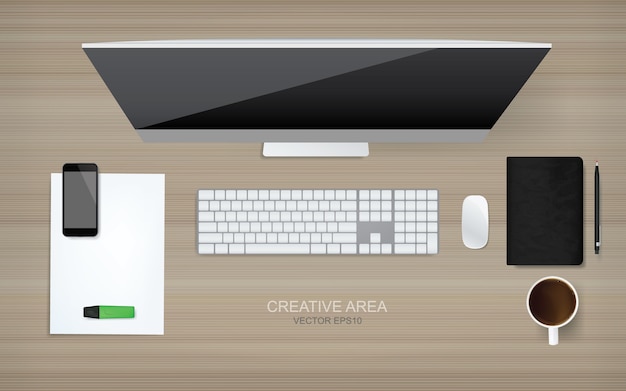 木製の背景に設定されたオフィスオブジェクトでトップビューコンピュータ。