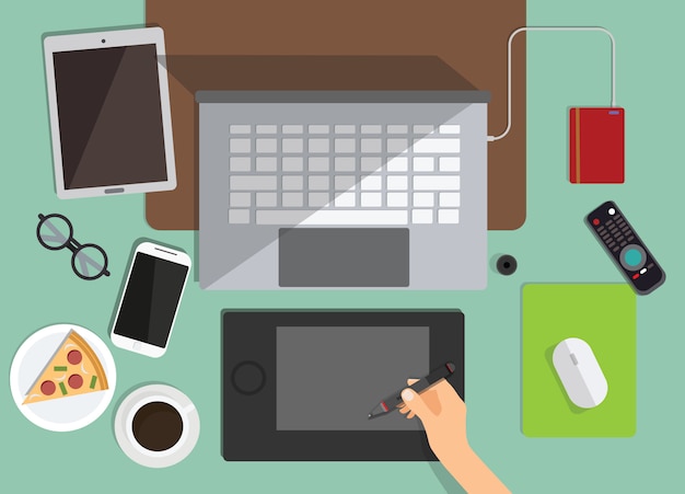 Vector top view of graphic designer  workplace on background. flat design of workspace with laptop,coffee,pizza