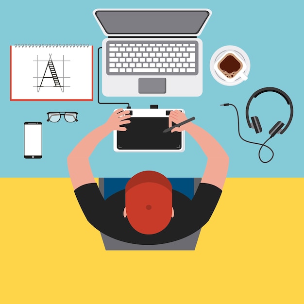 Top view young man designer working computer tools at desk