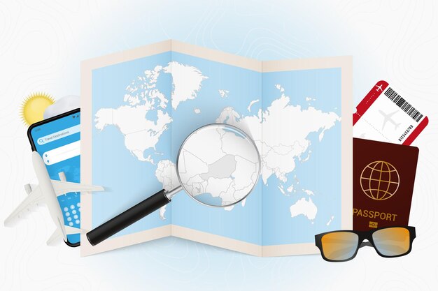 Travel destination Niger, tourism mockup with travel equipment and world map with magnifying glass on a Niger.