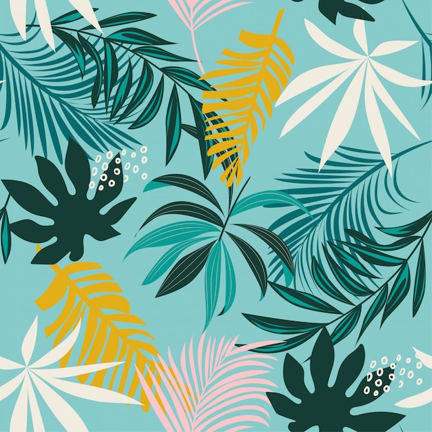 Trend seamless tropical pattern with colorful leaves and plants