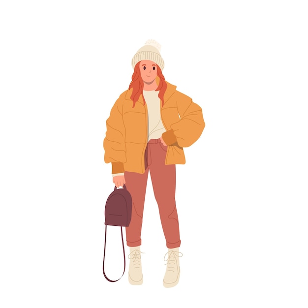 trendy fashion teenager girl wearing casual warm waterproof short puffer knitted hat standing with stylish handbag isolated on white background female dressed in oversize comfortable winter outwear