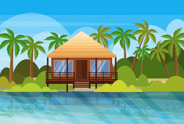 Tropisch eiland villa bungalow hotel op strand aan zee groene palmen landschap zomervakantie flat