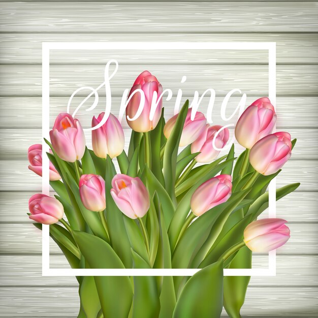 Tulips on a white wood background.