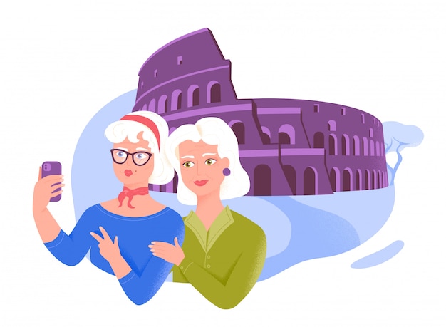 Twee hogere vrouwelijke vrienden die selfie dichtbij het Colosseum nemen.