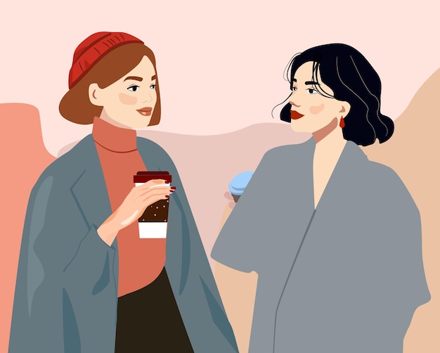 Twee vrienden drinken koffie. Vrouwen in warme kleding in de winter een gezellig gesprek bij een kopje