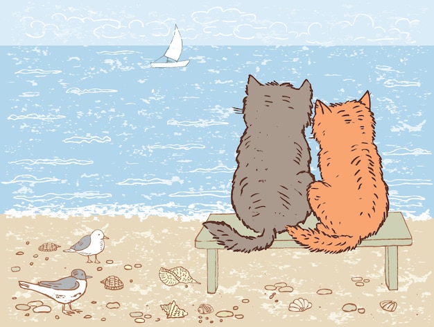 Two cats looking at the sea