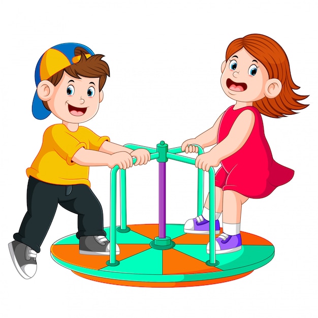the two children are playing on the round boat