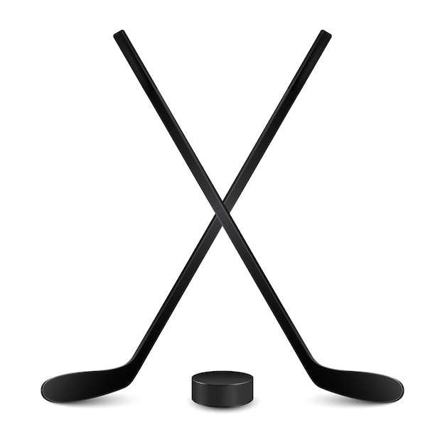 Two crossed hockey sticks and hockey puck. Isolated on white backgrund.  