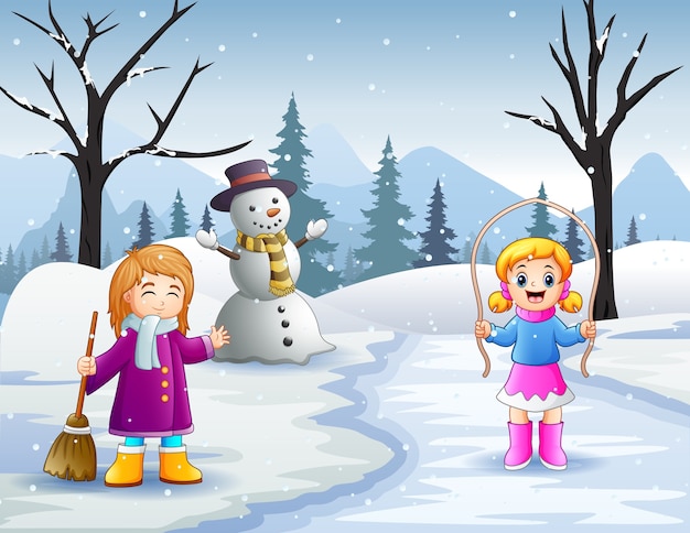 冬の雪景色の屋外で2人の女の子の活動