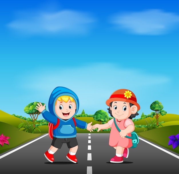 두 아이가 도로에 학교에 간다