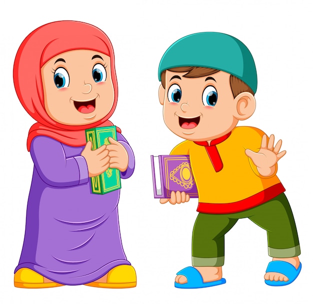 Two kids holding holy quran