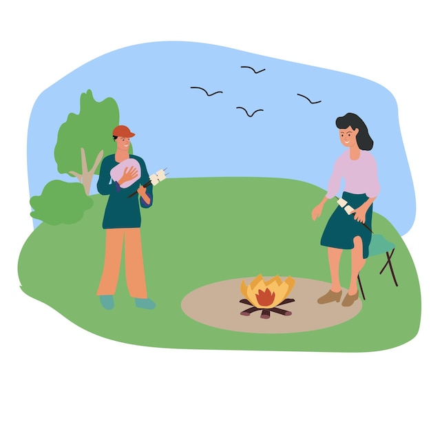 Two people man and women stand near campfire