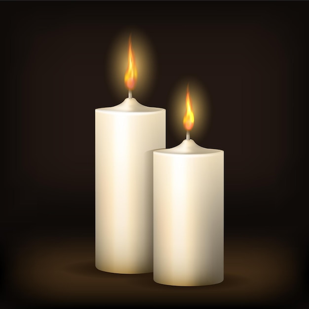 Two realistic burning candles at dark vector