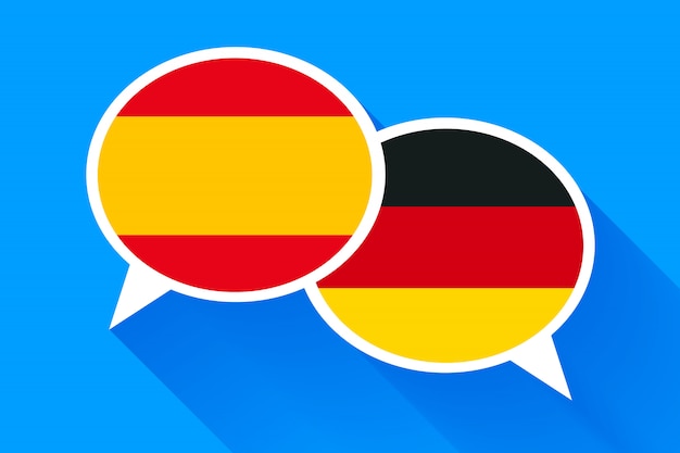 Two white speech bubbles with spain and german flags.