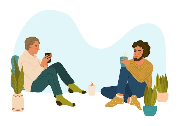 Vector two young men sitting, talking and drinking hot drink. cozy date on a cold evening. hygge lifestyle.
