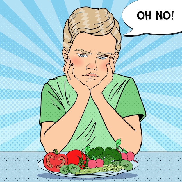 Upset child with plate of fresh vegetables