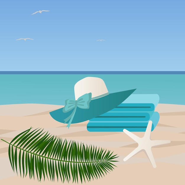 Vakantieconcept aan zee Een stapel handdoeken en een strandhoed liggen op een zandstrand