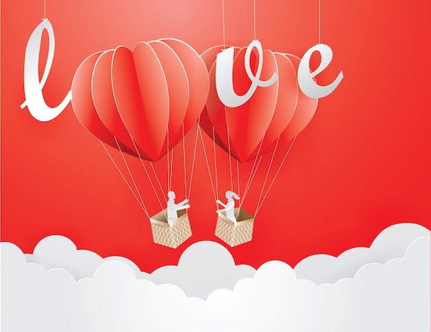 Valentine´s day concept with lover in heart shaped balloon on the sky.