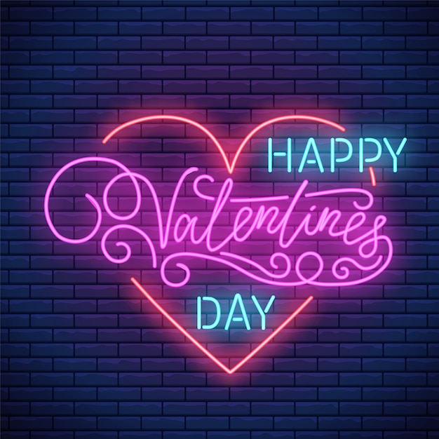 Insegna al neon di san valentino con forma di cuore brillante e scritte. emblema di san valentino saluto stile neon.