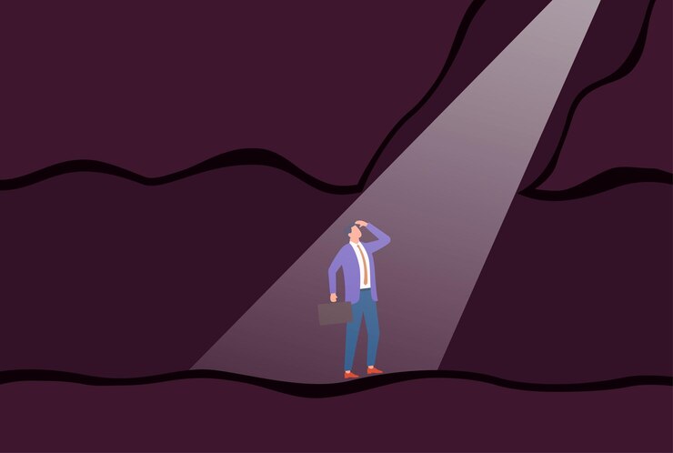 Vector vector illustration of a businessman standing alone in a dark underground tunnel holding a briefcase under a beam of light and looking ahead symbolizing uncertainty reflection