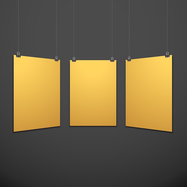 Vector vertical gold empty poster set suspended on office clamps mock up realistic shadow blank template isolated black background