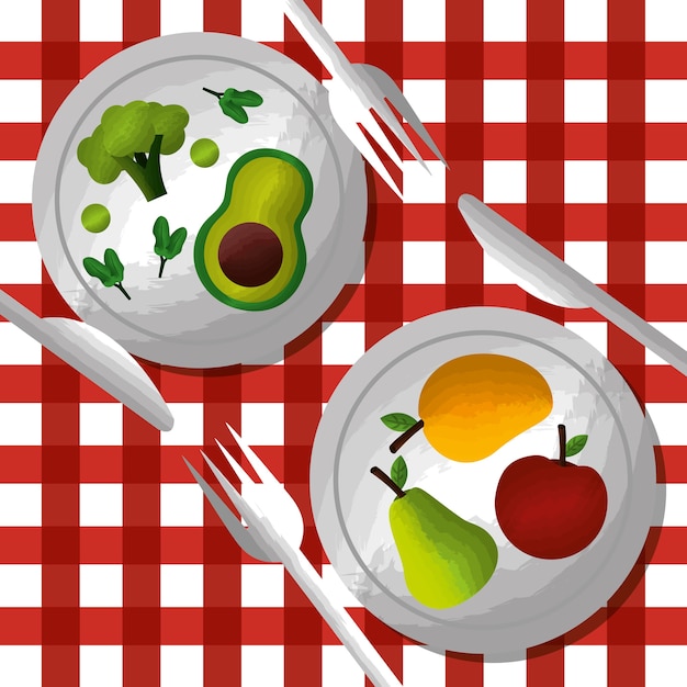 Vegetables and fruits on dishes fork knife on tablecloth