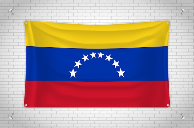 レンガの壁に掛かっているベネズエラの旗。 3D 描画。壁に取り付けられた旗。グループできれいに描く