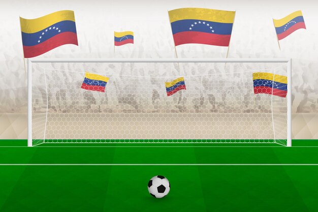 サッカーの試合でスタジアム ペナルティ キックのコンセプトを応援するベネズエラの国旗を持つベネズエラのサッカー チームのファン