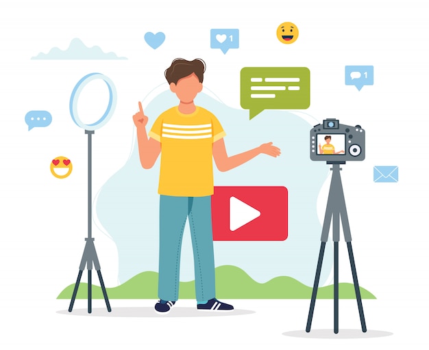 Video blogger che registra video con videocamera e luce.