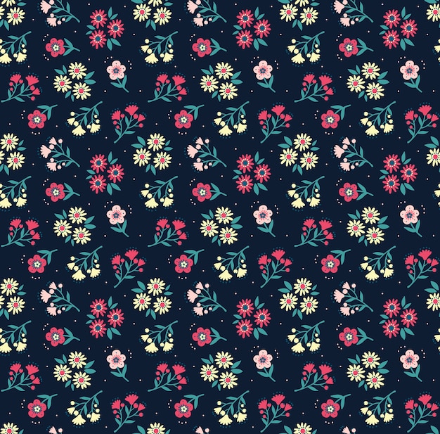 Vintage floral background. Seamless pattern for design and fashion prints. Flowers pattern with small colorful flowers on a dark blue background. Ditsy style.