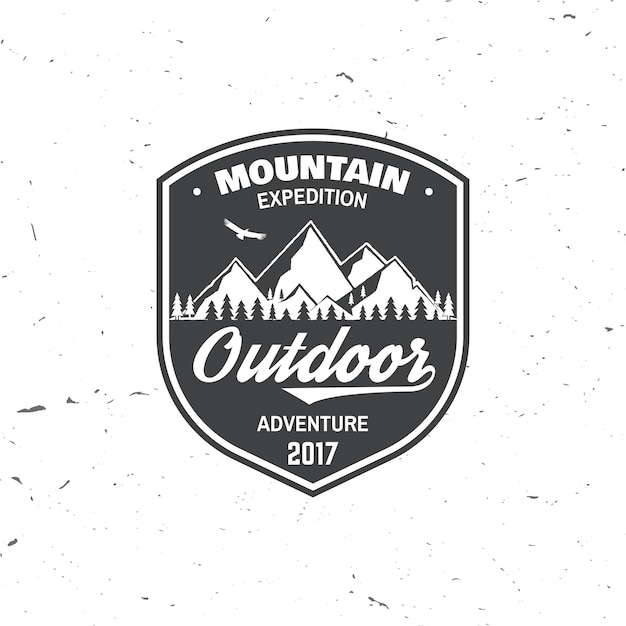 vintage typography design with soaring eagle and mountain silhouette