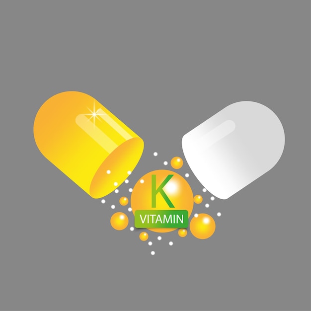 Vector vitamin k in open yellow capsule health pill vector illustration eps 10 stock image