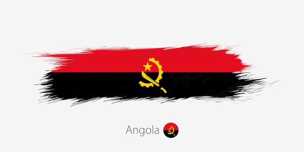 Vlag van Angola grunge abstracte penseelstreek op grijze achtergrond