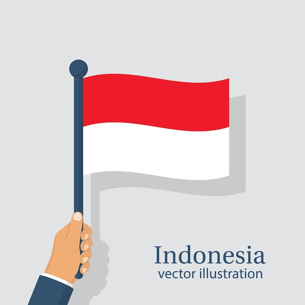 Vlag van Indonesië met in de hand man Onafhankelijkheidsdag is de nationale feestdag van Indonesië die jaarlijks wordt gevierd Vectorillustratie plat ontwerp geïsoleerd op een witte achtergrond 17 augustus