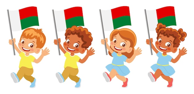 Vlag van Madagaskar in de hand. Kinderen die vlag houden. Nationale vlag van Madagaskar