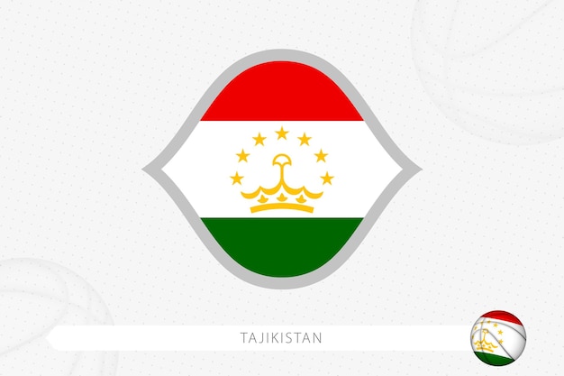 Vlag van tadzjikistan voor basketbalcompetitie op grijze basketbalachtergrond.