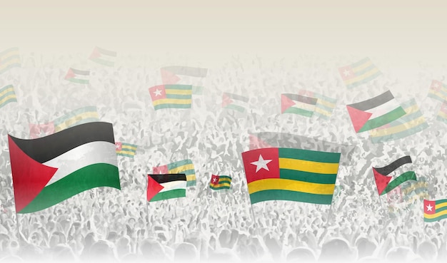 Vlaggen van Palestina en Togo in een menigte van juichende mensen