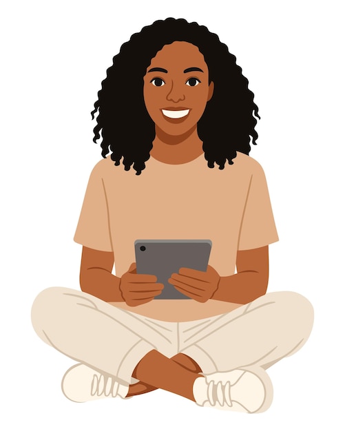 Vrouw met krullend haar die een tablet gebruikt