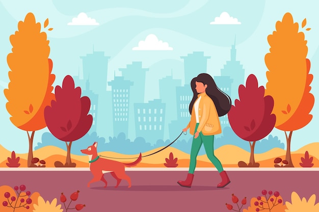 vrouw wandelen met hond in herfst park