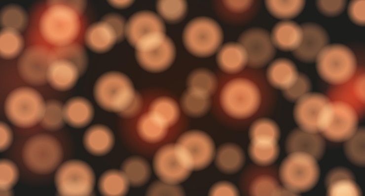Vector wallpaper with bokeh effect on dark background vector background