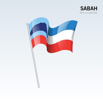 Sventolando la bandiera dello stato di sabah e del territorio federale della malesia isolati su sfondo grigio
