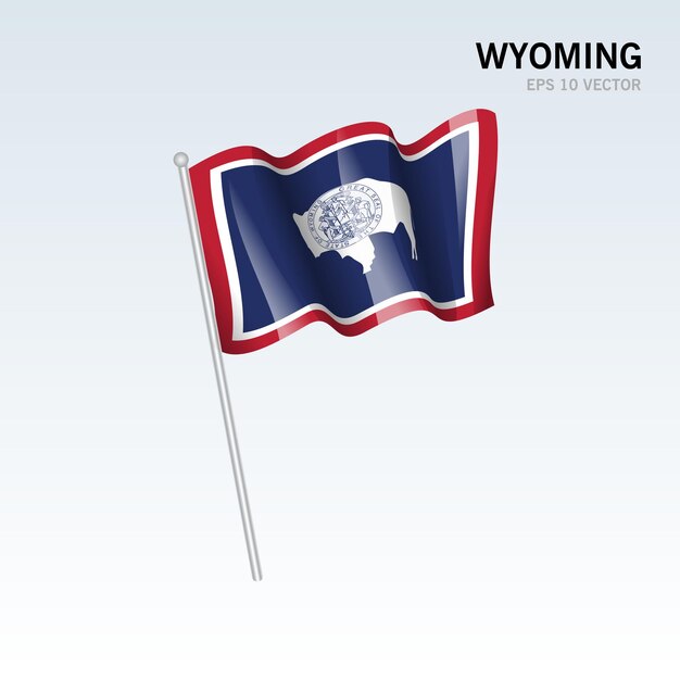 Sventolando la bandiera dello stato del wyoming degli stati uniti d'america su sfondo grigio