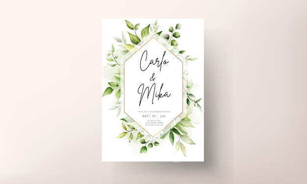 Vector wedding invitation card template with beautiful greenery leaves in alcohol ink background