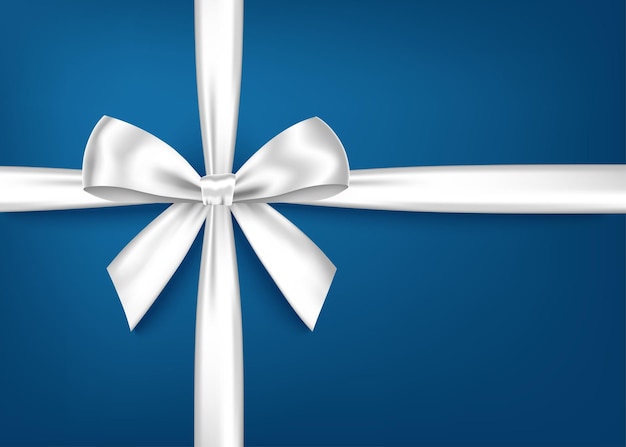 White  gift ribbon and bow isolated on blue