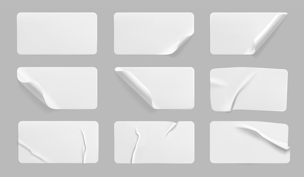 Vector white glued crumpled stickers with curled corners set.