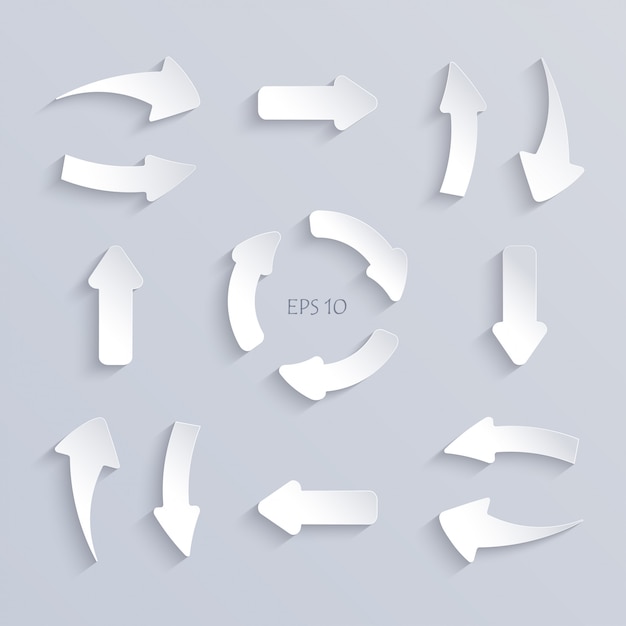 white paper cut arrows set with shadows.