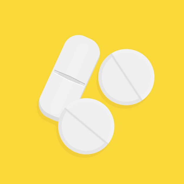 White pills on yellow background