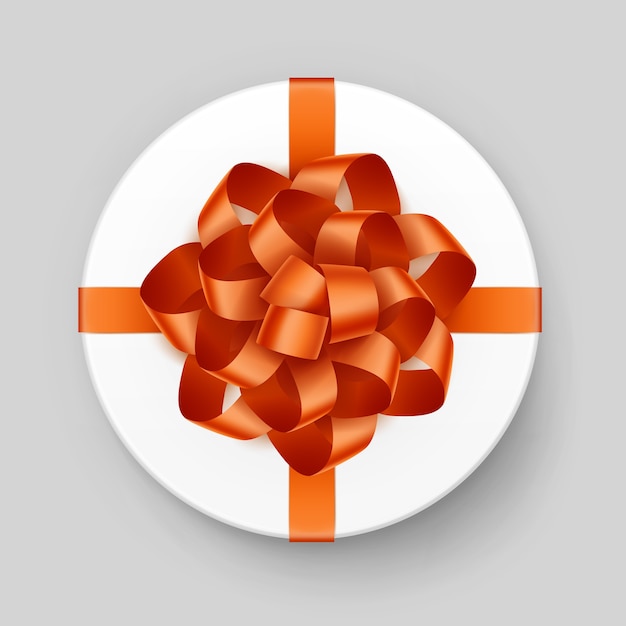 White Round Gift Box with Shiny Orange Bow and Ribbon Top View Close up Isolated on Background